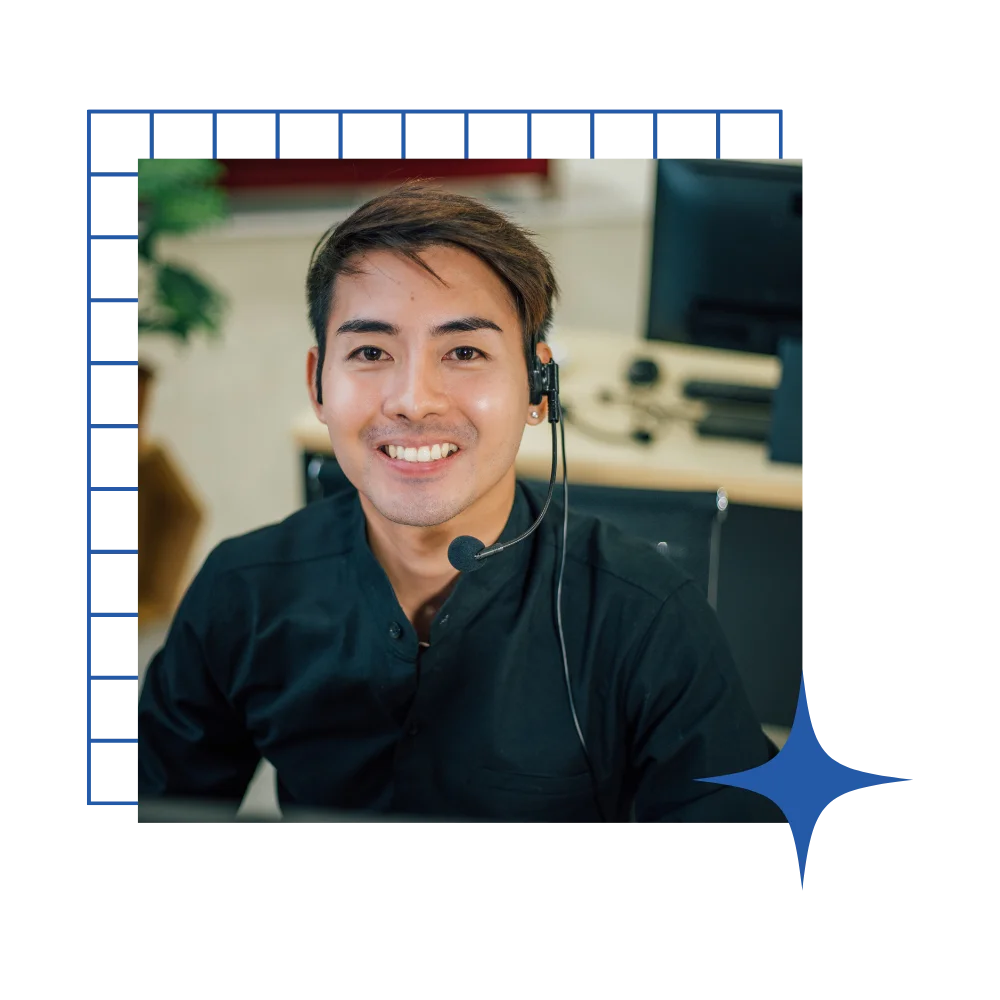 A happy man in a black shirt with a headset, illustrating a dental answering service dedicated to assisting patients