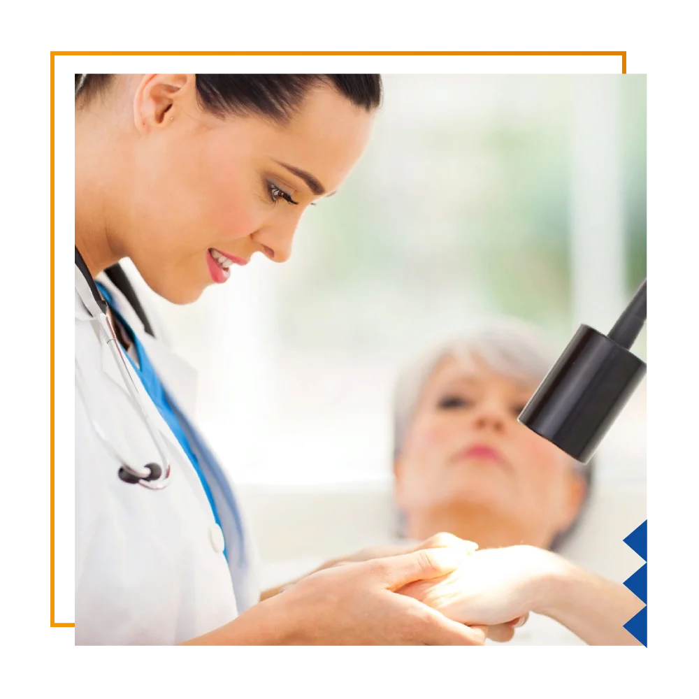 A woman analyzes a patient's hand using a microscope, reflecting the professionalism of the Dermatology