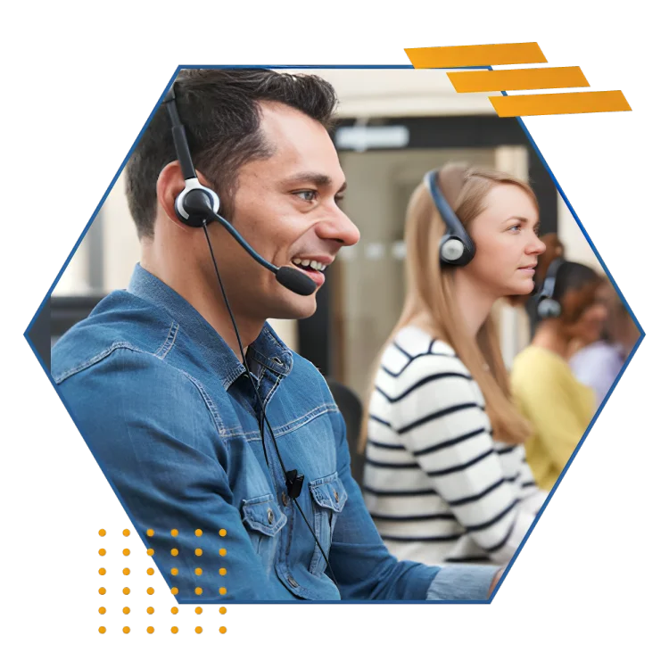 A smiling man with a headset sits in a call center, delivering professional home answering service to clients