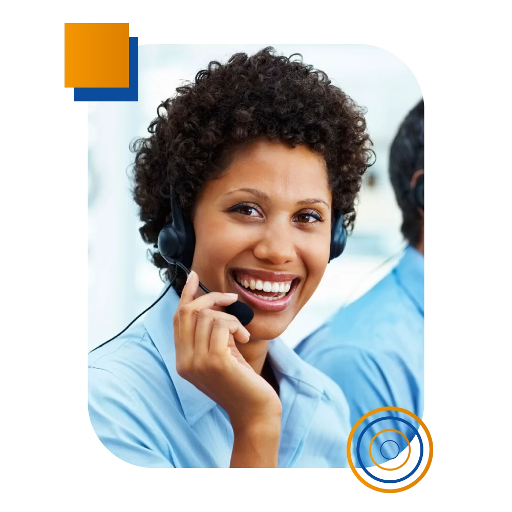 A smiling woman with a headset, providing IT answering service, while a man is visible in the background