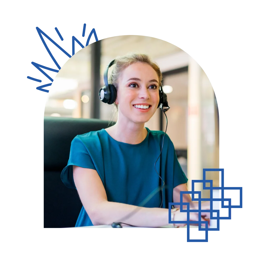 A woman in an office, wearing headphones and engaged in her tasks, showcasing a professional atmosphere