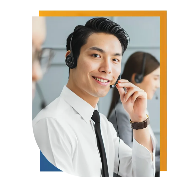 A happy man in a call center, wearing a headset, focused on delivering excellent customer service with a smile