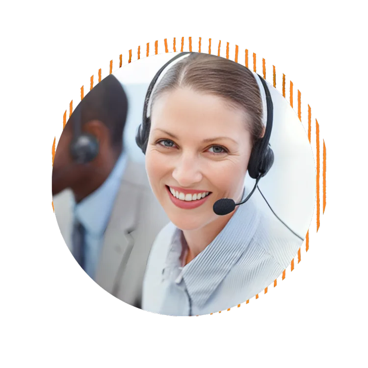 A smiling woman wearing a headset engages with a group of attentive individuals in a professional setting