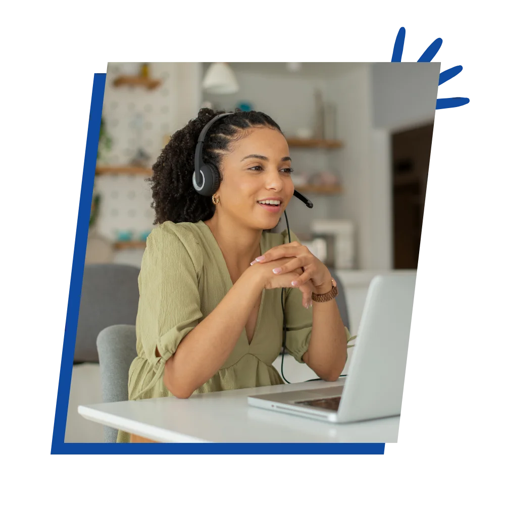 A call center agent efficiently assisting customers while working from home, surrounded by a computer and headset