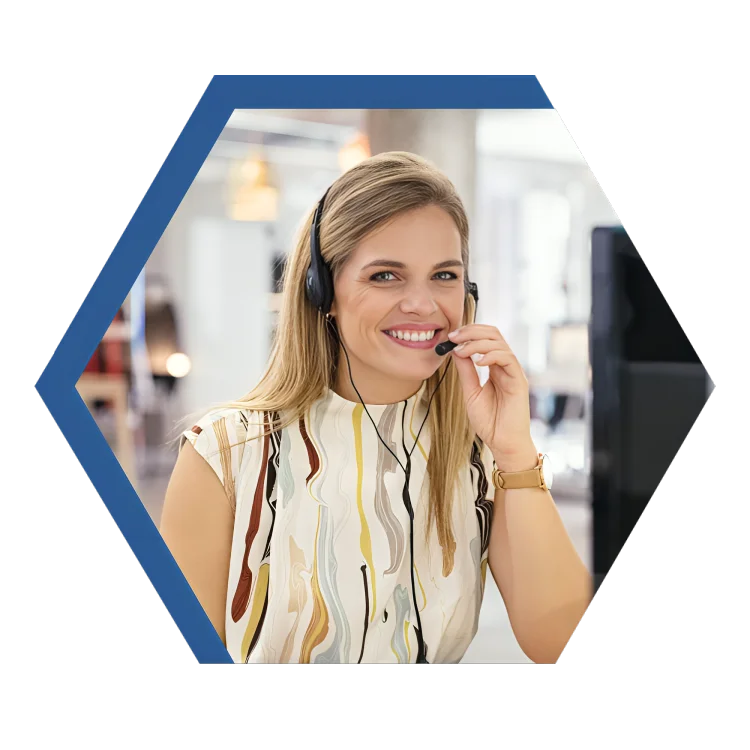 A woman using a headset in an office environment, demonstrating concentration and engagement in her work