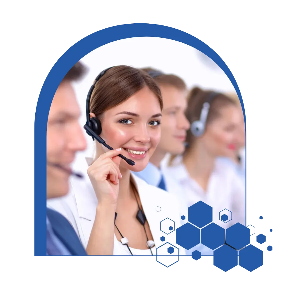 A woman with a headset smiles while engaged in a conversation at a call center, showcasing a positive work environment